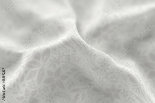 White fabric with a reflective floral pattern