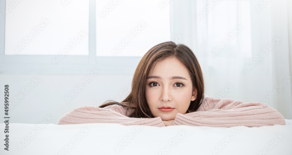 Portrait of beautiful sexy asian woman relax in her bedroom. Smile happy face asian girl on white background. Beauty treatment perfect clear skin japanese korean makeup hygge lifestyle winter concept Portrait of beautiful sexy asian woman relax in her bedroom. Smile happy face asian girl on white background. Beauty treatment perfect clear skin japanese korean makeup hygge lifestyle winter concept