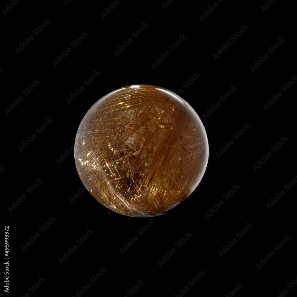 Ball of quartz with rutile on a black background Ball of quartz with rutile on a black background