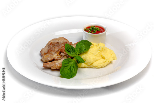 Roast pork with tomato sauce and mashed potatoes