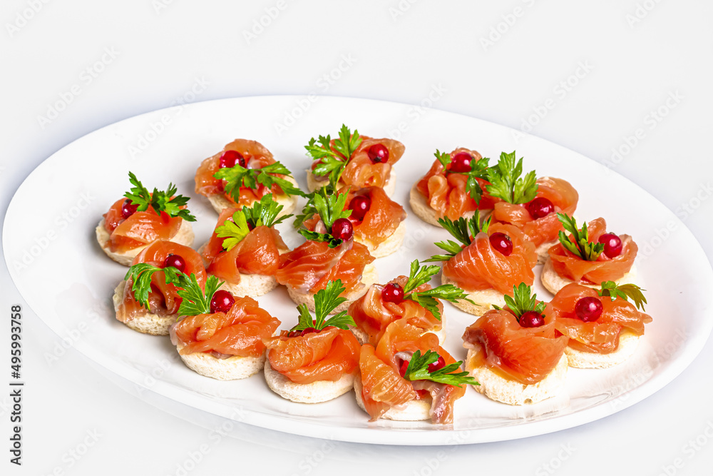 Canapes with lightly salted salmon and lingonberries Canapes with lightly salted salmon and lingonberries