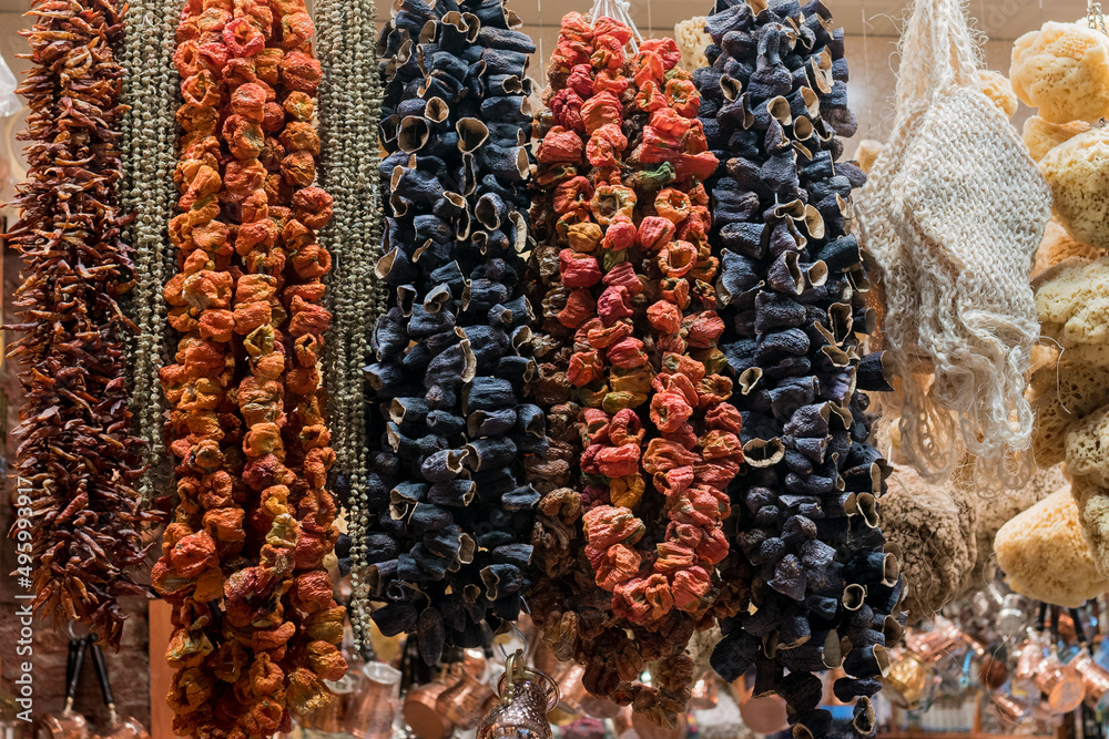 Turkish dried fruits on rope at display on bazar. Organic fruit snacks with high nutritional benefits.