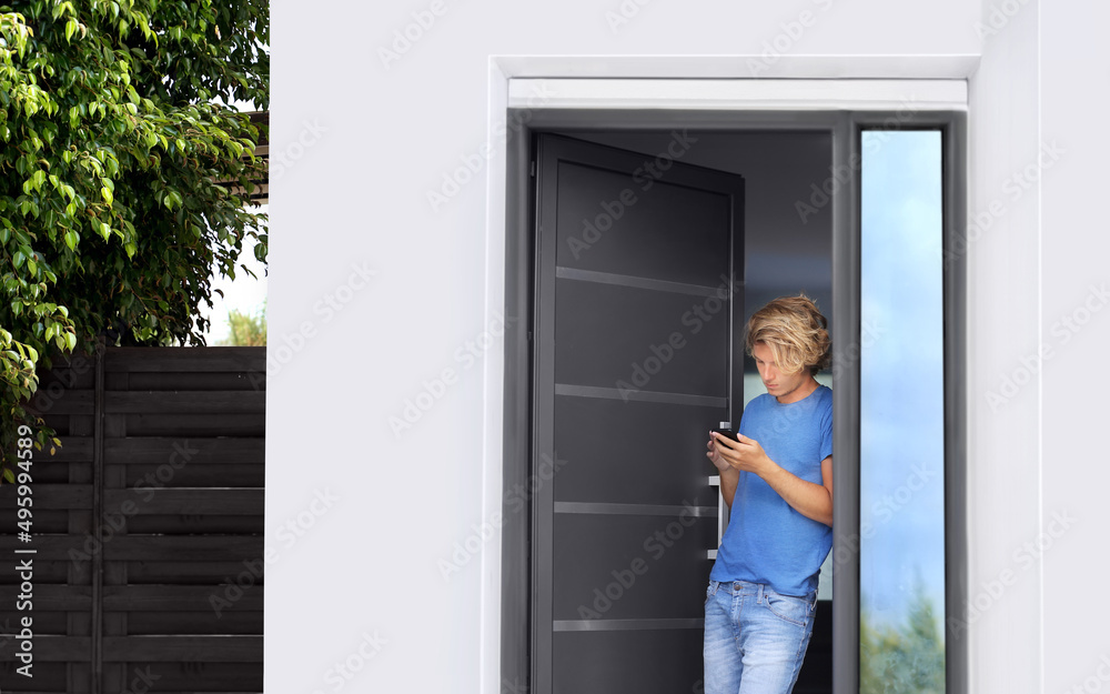 Man opening the door of her home.Inviting the guests.