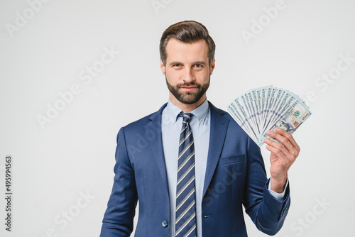 Prosperity wealth rich caucasian businessman ceo millionaire in formalwear suit holding money, buying expensive goods looking at camera isolated in white background