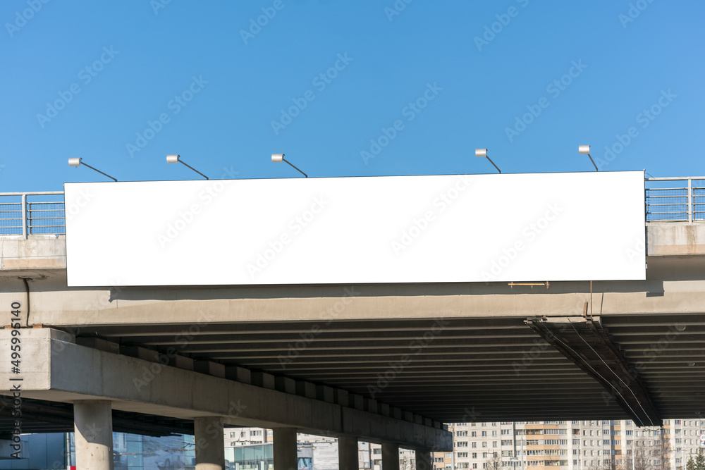 Long white empty signboard hanging on concrete urban bridge for commercial information and advertise message Long white empty signboard hanging on concrete urban bridge for commercial information and advertise message