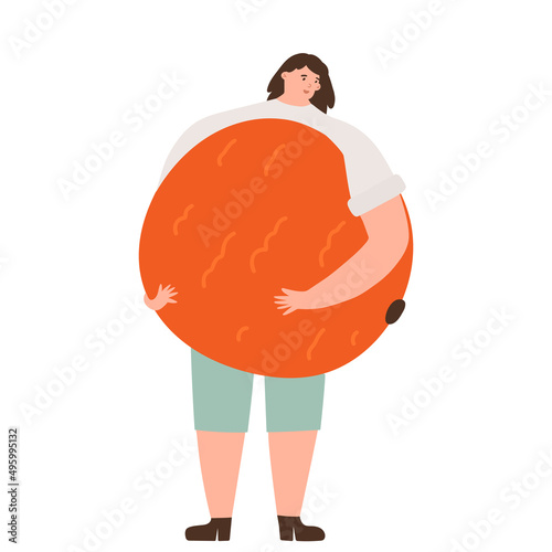 Happy woman holding a huge fresh orange. Eat local, organic, homegrown and healthy eating and veganism concept.