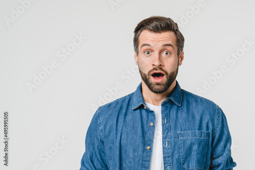 Closeup shocked disappointed caucasian young man expressing emotions for sale discount, hearing good bad news isolated in white background photo