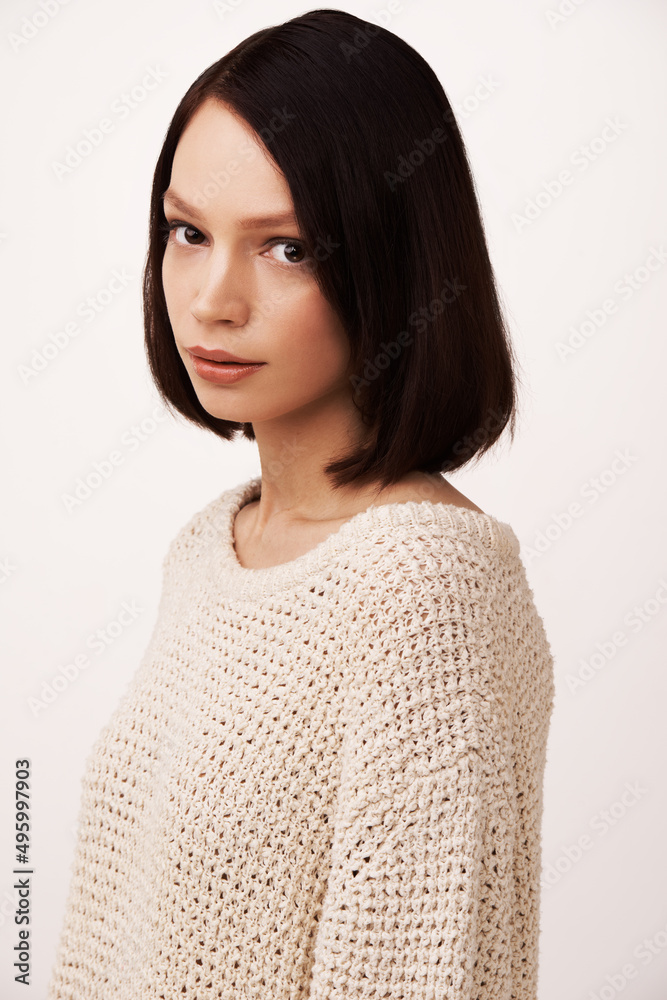 She always stays true to herself. Beautiful young woman against a white background.