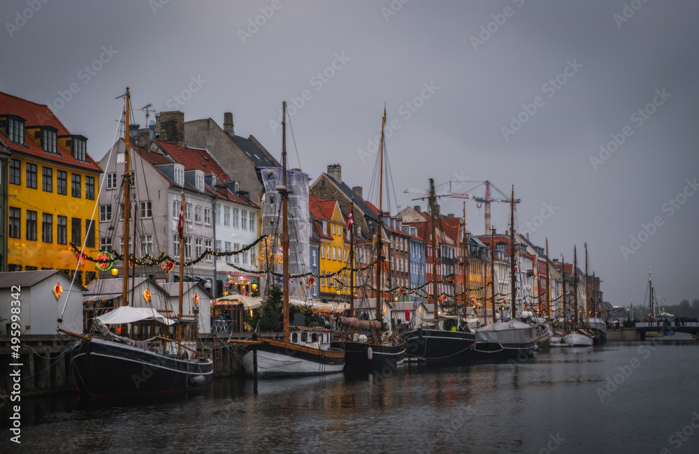 Fototapeta premium Copenhagen, Denmark on the Nyhavn Canal at sunset. November 2021