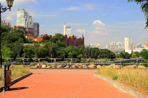 Beautiful tall white towers, skyscrapers, red buildings, against sky in summer and spring. Best view of Dnipro city street, Dnepropetrovsk, Ukraine