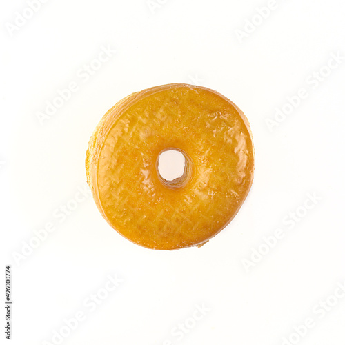 Top down view of a Regular Glazed Donut on white background with copy space.