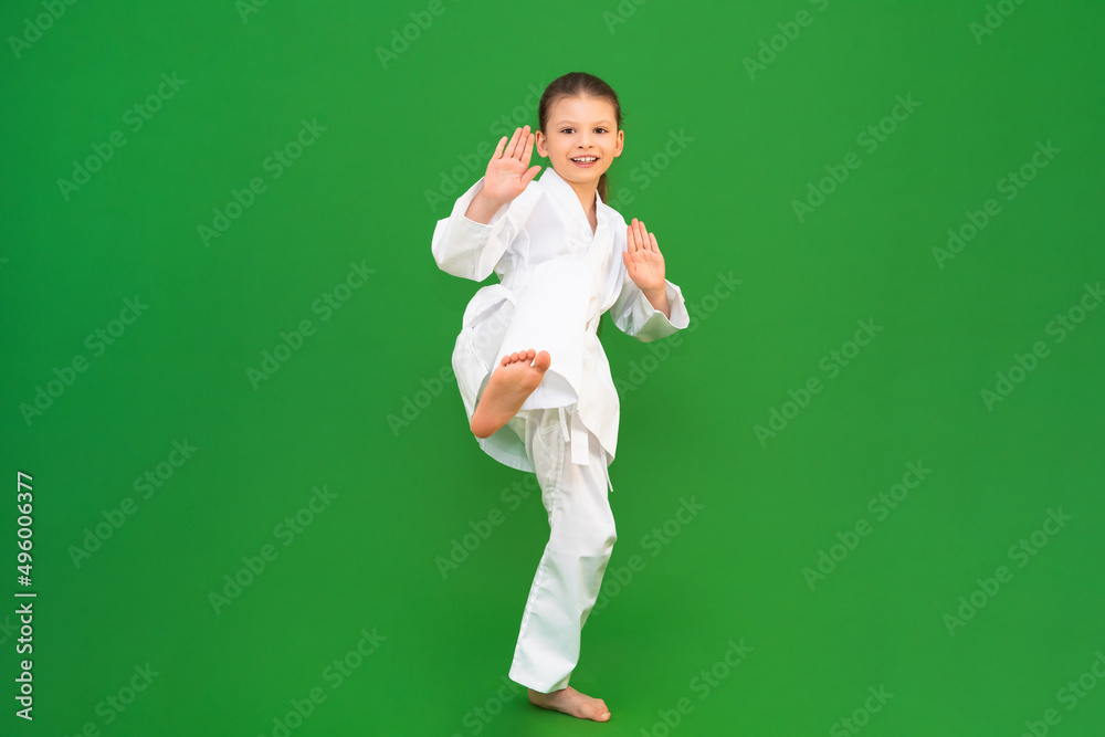 A child in a white kimono, karate for child development. A child in a white kimono, karate for child development.