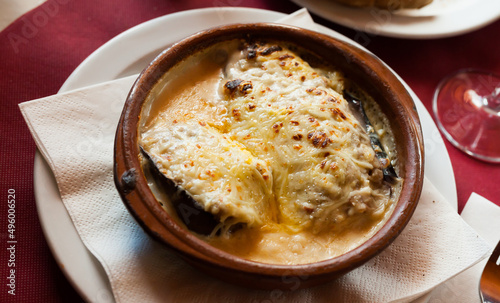 Traditional Spanish stuffed eggplants (berenjenas rellenas) with forcemeat and molten cheese