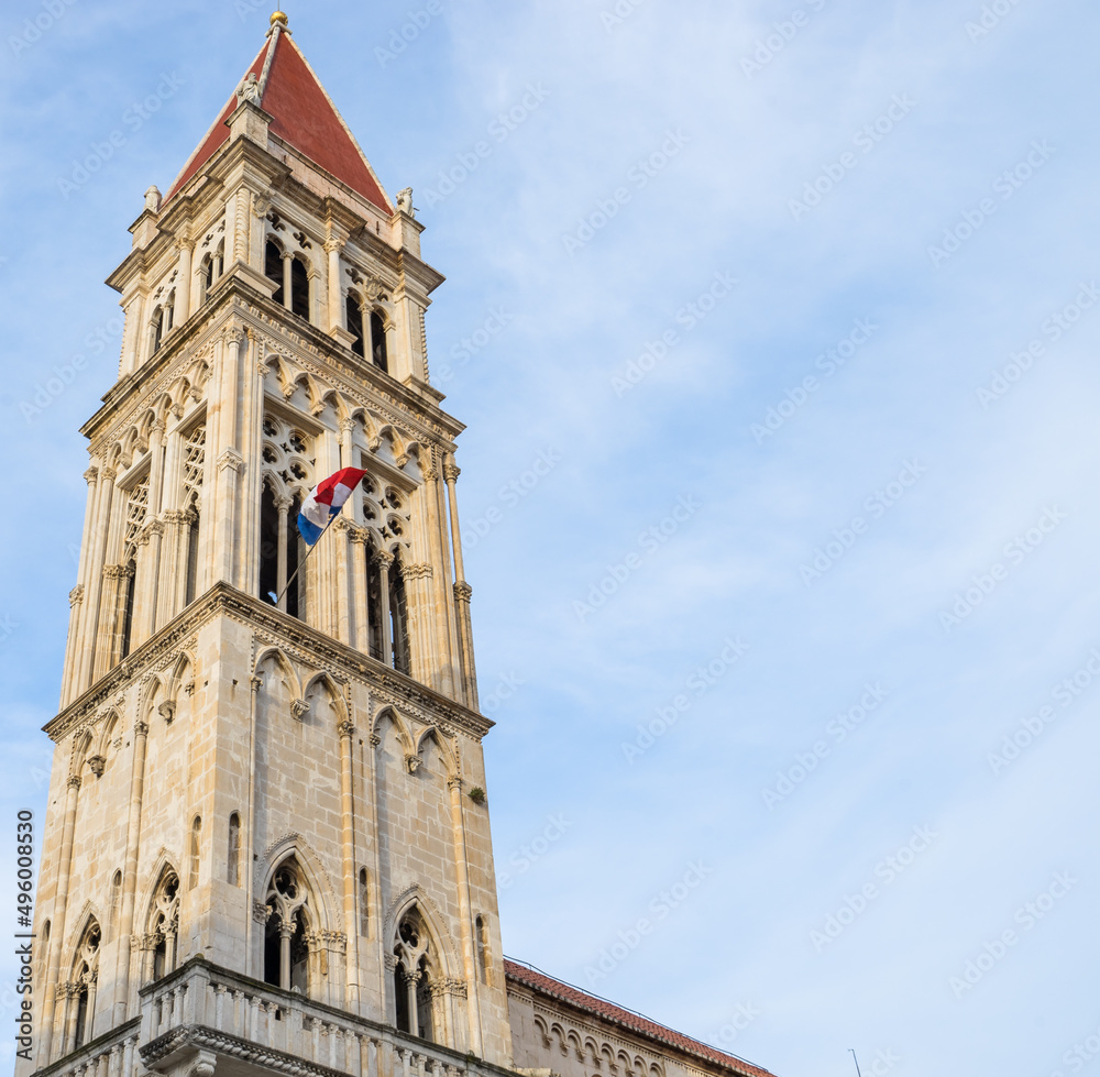 Tower of Trogir cathedral vertical view with blue sky