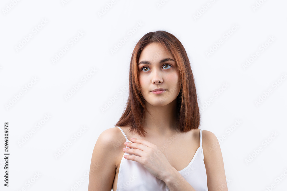 Beautiful smiling woman with clean skin, natural make-up and white teeth on a gray background Beautiful smiling woman with clean skin, natural make-up and white teeth on a gray background