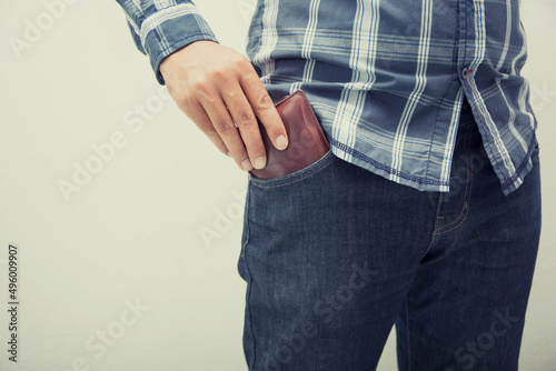 male and wallet in the back pocket of his blue jean