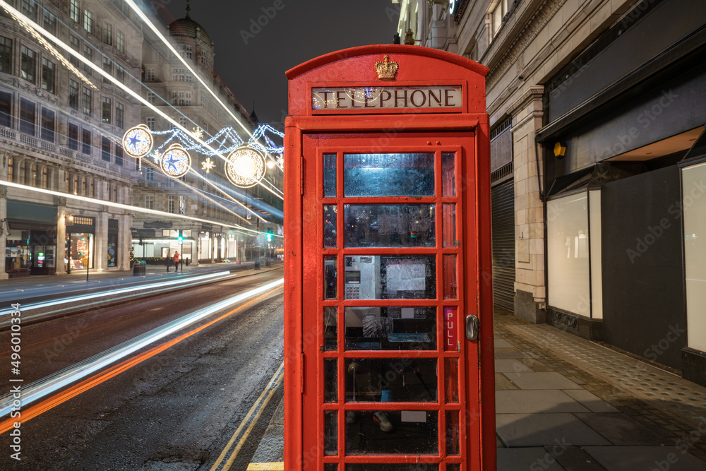 Red Telephone Box at Strand street illuminated by Christmas lights. London. England Red Telephone Box at Strand street illuminated by Christmas lights. London. England