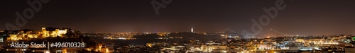 Ultra wide skyline panorama of Lisbon at night. Portugal