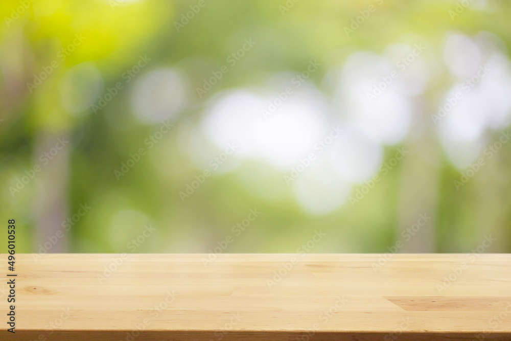 Empty wooden table with garden bokeh background with a country outdoor theme,Template mock up for display of product Empty wooden table with garden bokeh background with a country outdoor theme,Template mock up for display of product