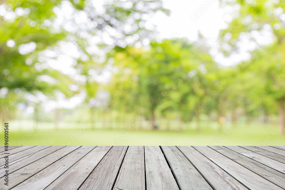 Empty wooden table with garden bokeh for a catering or food background with a country outdoor theme,Template mock up for display of product Empty wooden table with garden bokeh for a catering or food background with a country outdoor theme,Template mock up for display of product