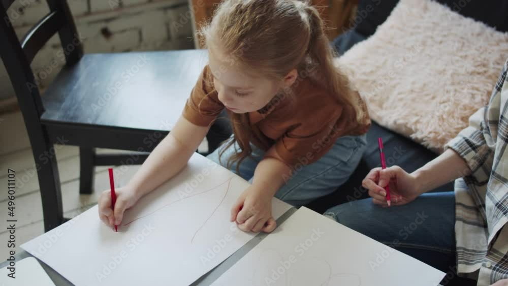 Child at a session of a psychologist. The girl is engaged in therapeutic drawing Child at a session of a psychologist. The girl is engaged in therapeutic drawing