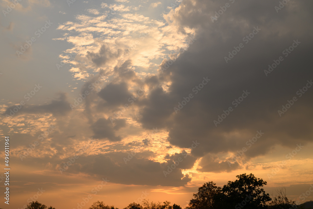 Vanilla sky with cloud and sunlight above trees before sunset, Natural background Vanilla sky with cloud and sunlight above trees before sunset, Natural background