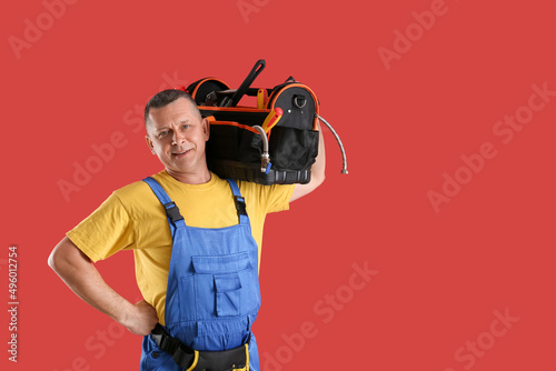 Handsome plumber with tools...