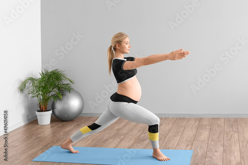 Young pregnant woman doing ...