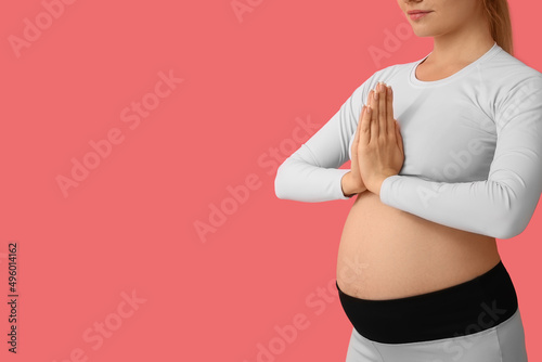 Young pregnant woman medita...