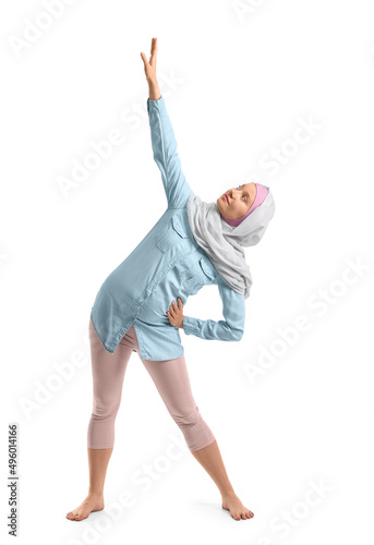Pregnant Muslim woman doing...