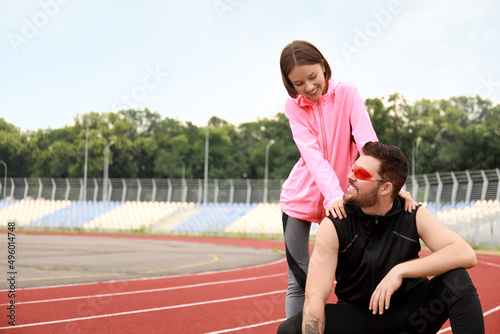 Sporty young couple at stadium