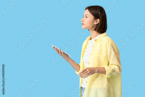 Young woman with tablet on ...