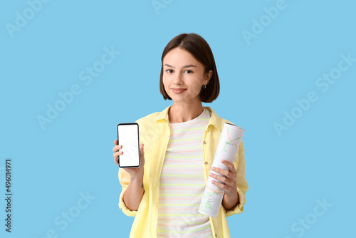 Young woman with map and ph...