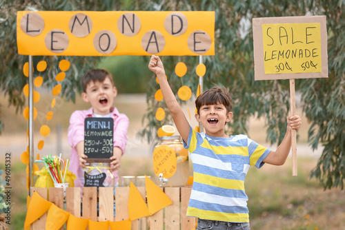 Cute children selling lemon...