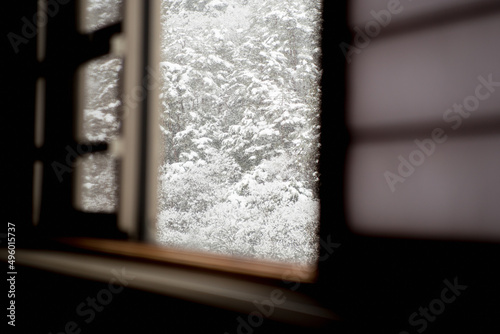 Mountain covered with snow in Japan through Japanese shoji window photo