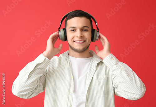 Young man in wireless headp...