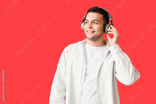 Young man in wireless headp...