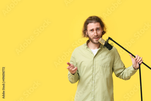 Handsome young man singing ...
