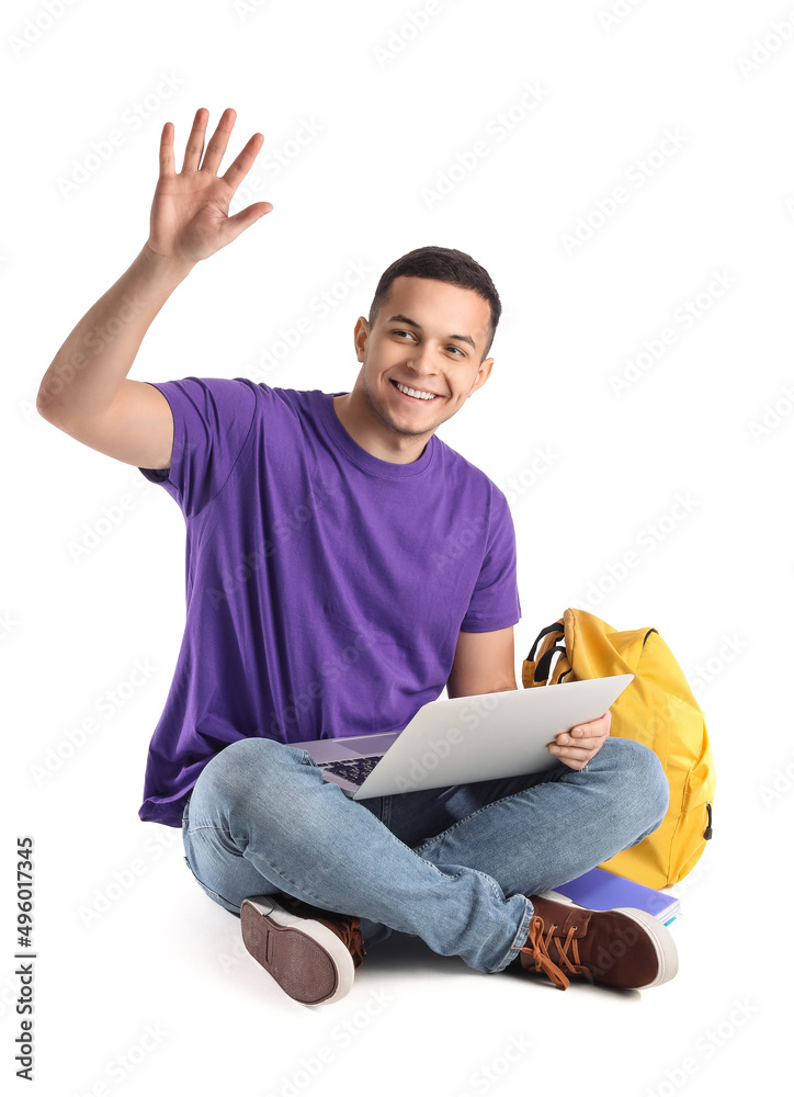 Handsome student with laptop waving hand on white background Handsome student with laptop waving hand on white background