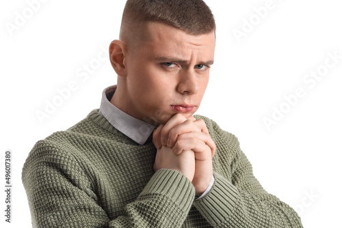 Troubled young man on white...