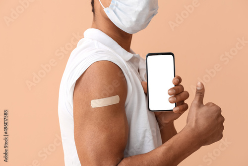 Young man in mask with appl...