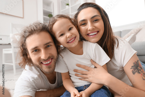 Happy young family taking s...