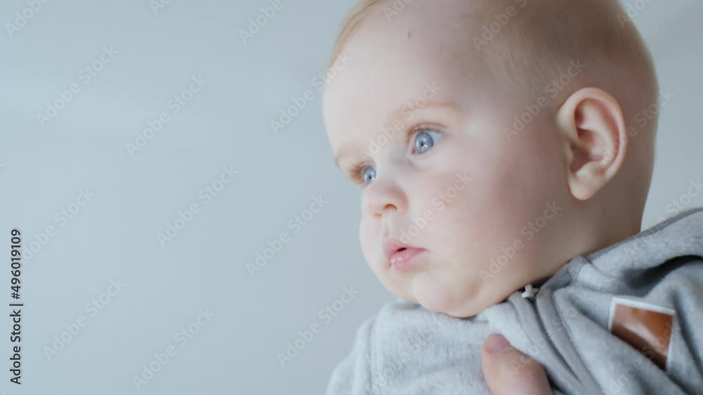 Newborn baby boy is very cute and adorable toddler with pretty face and huge innocent eyes. Child is very curious, smart and active, showing many of different emotions. Newborn baby boy is very cute and adorable toddler with pretty face and huge innocent eyes. Child is very curious, smart and active, showing many of different emotions.