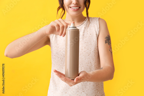 Smiling woman holding and p...