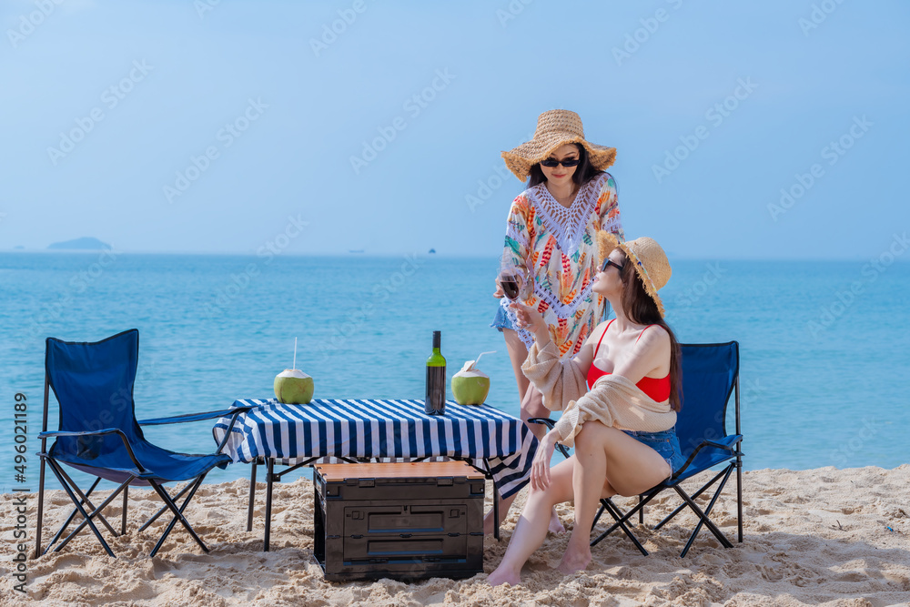 Sexy beautiful wearing beach suite and hat beach showing happiness on beach is summer holidays concept.