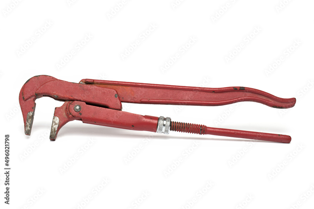 Closeup massive red pipe wrench white background Closeup massive red pipe wrench white background