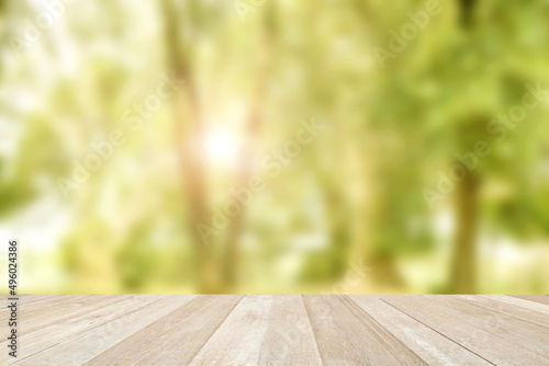 Empty top wooden table on soft focus blurred summer of nature background