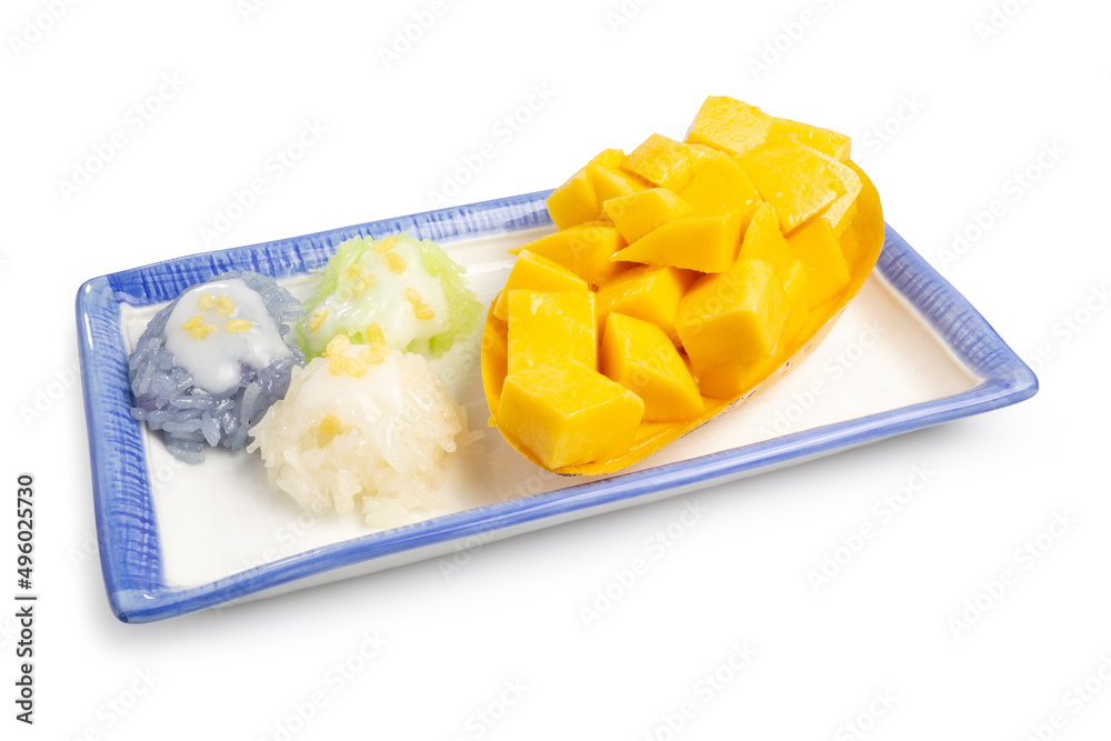 Fresh Ripe Thai Mango and Herbal Colored Sticky Rice, Authentic Thai Desserts topping with golden roasted beans and coconut milk served on a dish isolated on white background. Clipping path Fresh Ripe Thai Mango and Herbal Colored Sticky Rice, Authentic Thai Desserts topping with golden roasted beans and coconut milk served on a dish isolated on white background. Clipping path