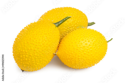 Group of Fresh Gac Fruit or Baby Jackfruit, bright yellow fruit in round shape with thorns, isolated on white background. Clipping path