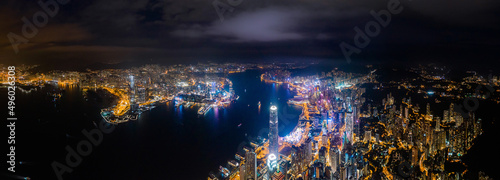 Fototapeta Naklejka Na Ścianę i Meble -  Amazing night aerial view of cityscape of Victoria Harbour, center of Hong Kong
